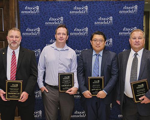 USANAA winners holding their plaques.