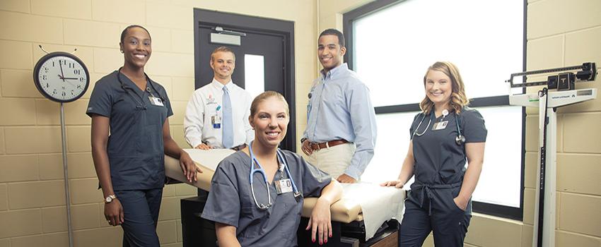 Image of two female and male medical students